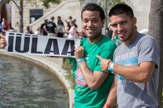 2 men holding an IULAA sign